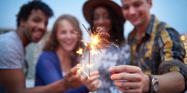 web3-friends-rooftop-sparklers-fireworks-fourth-of-july-shutterstock